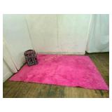 Zebra-Print Rolling Suitcase and Pink Rug