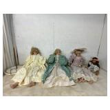 Four Porcelain Dolls with Accessories