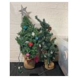 Tote of Small Artificial Christmas Trees