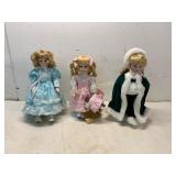 3 Porcelain Dolls with Detailed Attire