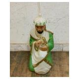 ÂFigurine of Seated Man in Green Robe