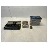 DVDs, Gun Cleaning Kit, and Novelty Tin