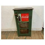 Green Wooden Cabinet With Coca-Cola Advertisement