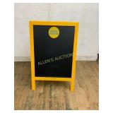 Yellow A-Frame Chalkboard with High Noon Logo