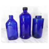 Three Blue Glass Bottles