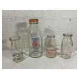 Four Glass Milk Bottles