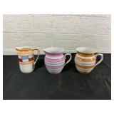 3 Ceramic Pitchers with Striped Patterns