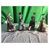 Four Ceramic Figurines with Women and Dogs