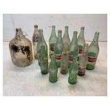 14 Glass Bottles Including Coke, Cheerwine, and Pe