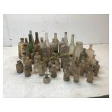 49 Assorted Glass Bottles and Tools