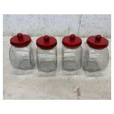 Four Glass Jars with Red Lids