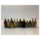 11 Glass Bottles of Various Types
