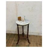 Marble-Top Table with Decorative Figurines