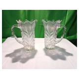 Two Embossed Glass Pitchers