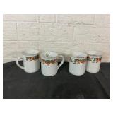 Four Holiday-Themed Ceramic Mugs