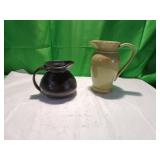 Two Ceramic Pitchers: Black and Beige Glazes