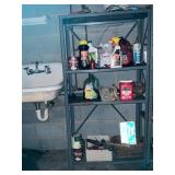 Metal Shelving With Assorted Cleaning Supplies