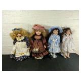 Four Ceramic Dolls with Stands