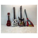 3 Guitar Hero Controllers and Ukulele