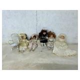 Six Porcelain Dolls with Accessories