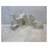 Four Ceramic Figurines in White Glaze