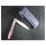 A Trio of Damascus Steel Folding Knife, Sheath, an