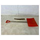 Orange Plastic Snow Shovel and Hand Saw