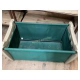 Green Canvas Storage Bin with Assorted Clothing