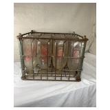 Old metal milk crate of 12 Pet Milk bottles