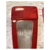 Tail light lens with reverse clear lens