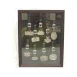 John Deere set of (9)-pewter watch fobs in hanging display case