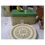 Metal bread box, 1954 calendar plate, and granite strainer