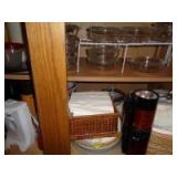 Lower cabinet containing glassware and paper products
