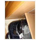 Granite roasters and misc. items in lower cabinet