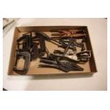 Flat of C-clamps and vice grips