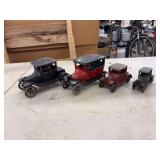 (4) Cast Iron Cars