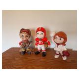 Three Ceramic Figural Statues: Hunter, Football Player, and Cheerleader