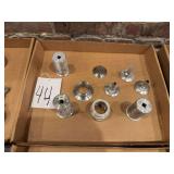 machined stainless steel and aluminum components, likely used in industrial, food processing, or chemical applications.