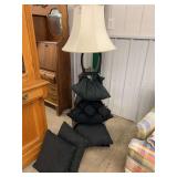 Floor Lamp with Geometric Shelving and Assorted Black Decorative Pillows