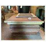 Stack of Particle Board Panels with Metal Sheets
