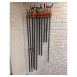 Collection of Pipe Clamps with Wall-Mounted Storage Rack