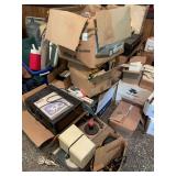 Large Media and Electronics Lot Including VHS Tapes, Cassettes, Record Players, and Projector
