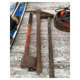 Assorted Hand Tools Including Pickaxe, Splitting Maul, and Sledgehammer