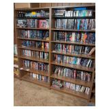 Large Collection of Assorted DVD and VHS Movies on Bookshelves