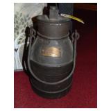 small black metal cream can with lid