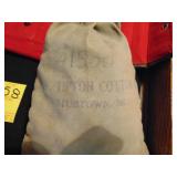JW Tipton Cotton Co. Bag full of red/white marbles