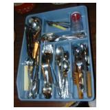container full of Flatware and utensils plus