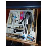 Drawer full of kitchen Utensils