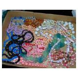 Flat full of costume beaded necklaces