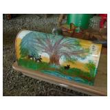 painted mail box, fishing stool, black cat